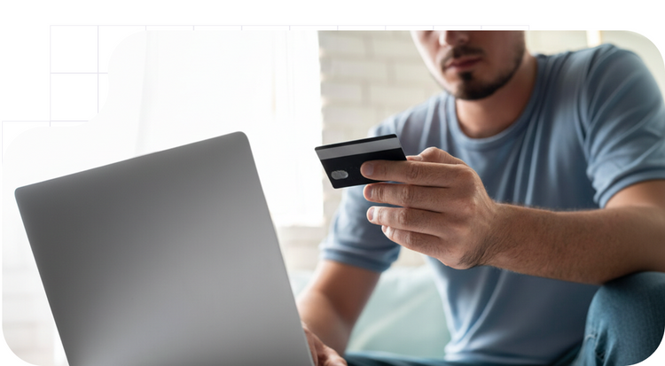 Boy with a computer making a card payment